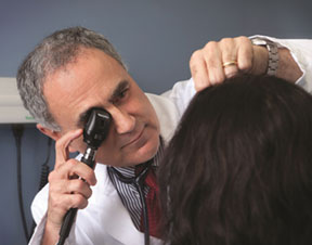 Dr. O.T. Adcock, lead physician for Riverside’s Patient-Centered Medical Home model, doing an annual wellness exam for one of his primary care patients.